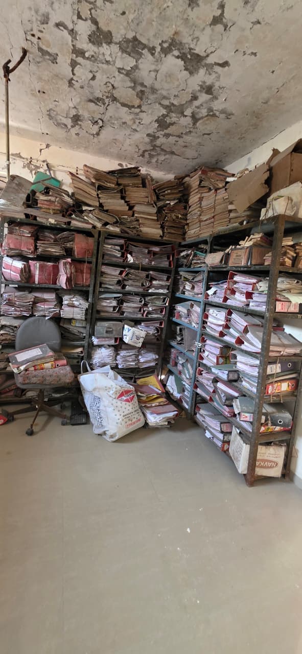 Bank branch archive room packed with box files