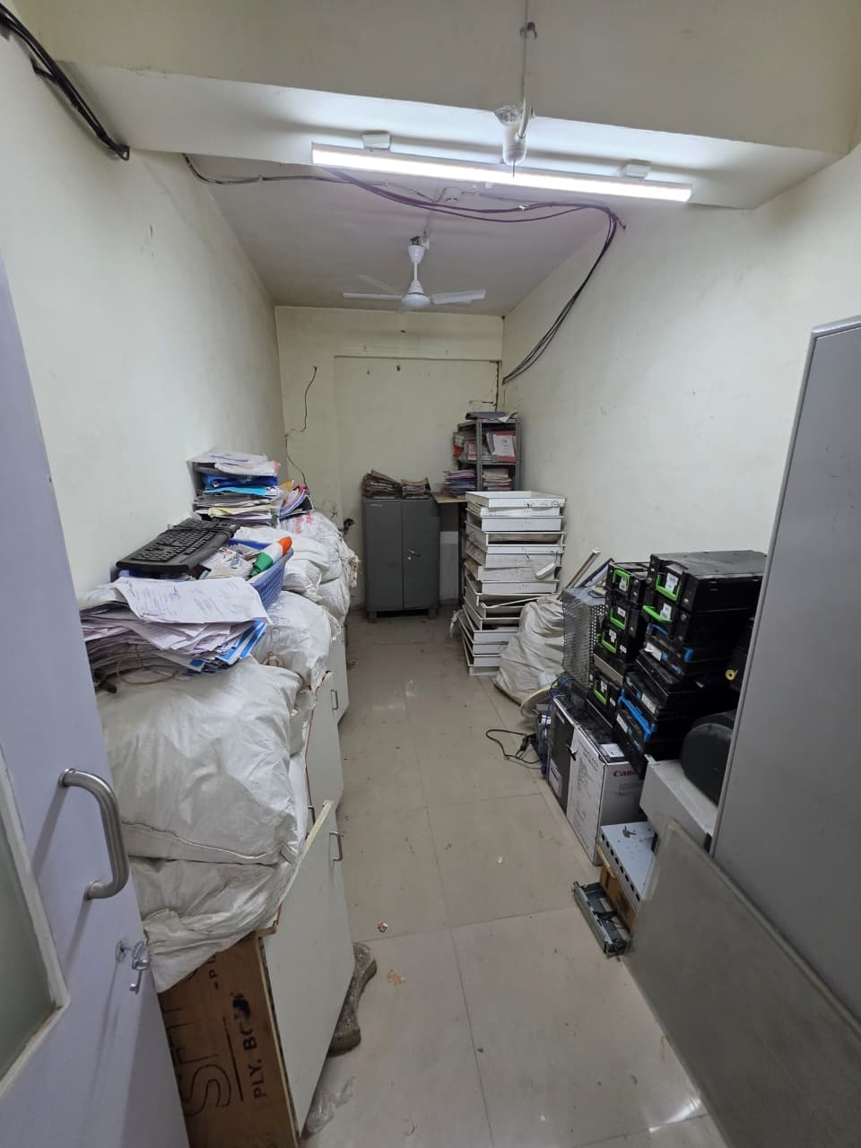 Retired computers and office electronics staged for collection